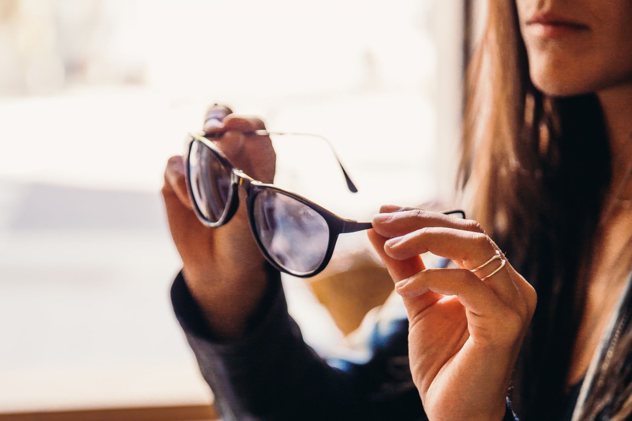 Woman looking through glasses